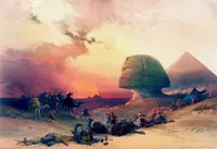 A historical-style painting of a desert landscape at sunset, with the Great Sphinx of Giza and a pyramid in the background. A group of travelers and camels crosses the desert while several people and camels lie or rest in the foreground. The sky is filled with warm pink, orange, and golden clouds, creating a dramatic atmosphere.