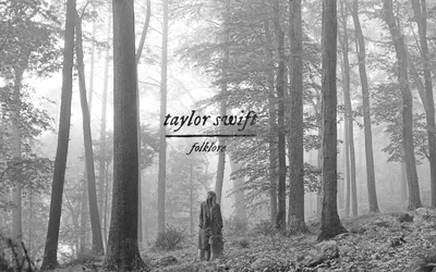Black and white photograph of a misty forest with tall trees. A person in a coat stands alone among the trees in the foggy woodland. Text overlay reads 'taylor swift' in italic script font, with 'folklore' written below in a similar style with an underline.